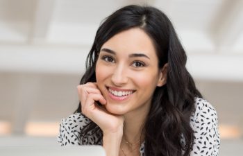 Cheerful young woman with a perfect smile.